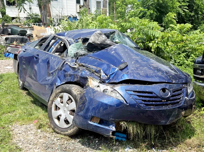 Vehicle strikes parked dump truck on Camden Avenue